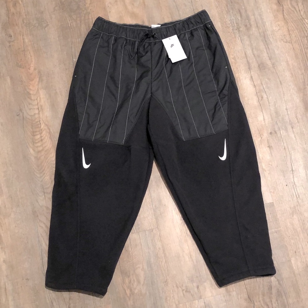 New (with tags) crop style Nike pants with fleece lining